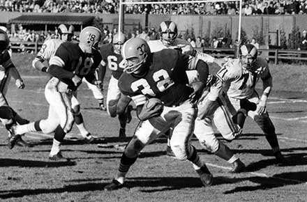 Jim Brown runs for most yards in a single game, 1957