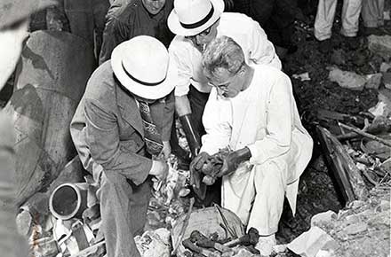 Inspecting remains of torso murderer victim, 1938