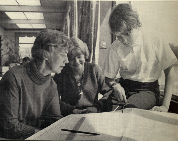 Photo of Manry family studying chart