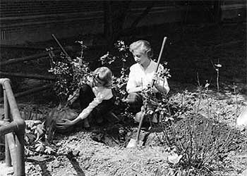 Teacher and student gardener at William Rainey Harper elementary school garden, May, 1959