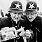 Two men costumed as comical cops, 1975 
