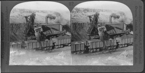 Digging Iron Ore With Steam Shovel and Dumping on Train, Open-pit Iron Mine, Minn.