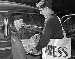 Cleveland Press news carrier receives supply of papers, 1946