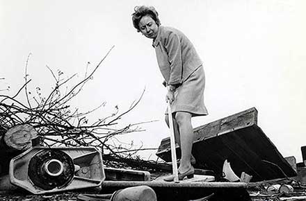 Betty Klaric cleaning up park, 1969.